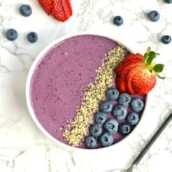 Wake up to a creamy Berry Hemp Smoothie Bowl laced with sweet berries, Greek yogurt and hemp protein powder! This gluten free smoothie bowl is a nutritious and refreshing meal or snack for warm weather and great for post workout recovery!