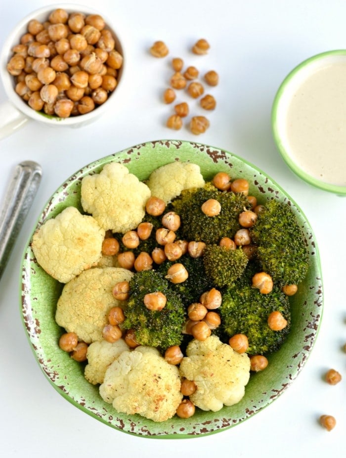Broccoli Cauliflower Chickpea Bowl with a rich and creamy Tahini Lemon Sauce! This simple roasted vegetable and chickpea bowl is gluten free, Vegan and low calorie. A super EASY and satisfying meal guaranteed to keep you full for hours. Great for lunch, dinner or snacking! 