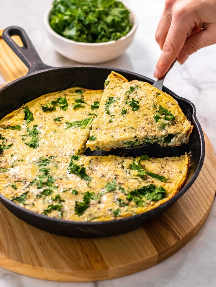 Cauliflower Kale Frittata is a low calorie egg bake with cauliflower rice, kale and spices! A savory protein breakfast that only has four ingredients and takes under 30 minutes to make!
