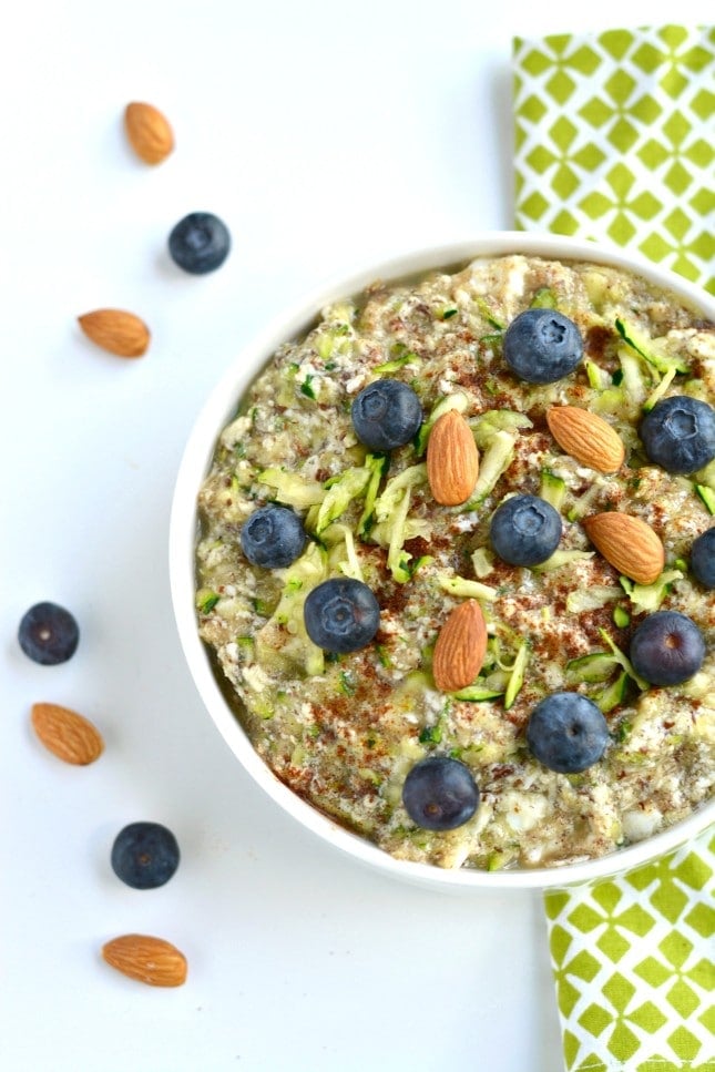 Zucchini Oatless Oatmeal is a Paleo twist on a classic bowl of morning oatmeal. Made with eggs, almond milk, zucchini, applesauce, flaxseed and cinnamon, this simple bowl of goodness is packed with protein and fiber. A nutritious way to stay full all morning!