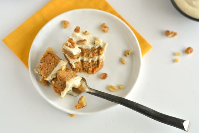 Paleo Raw Carrot Cake is a spin on a traditional favorite! Made with a carrot, date and walnut base, this delicious cake is topped with a silky cashew maple coconut icing that's surprisingly healthy and good for you. This is what carrot cake dreams are made of! 