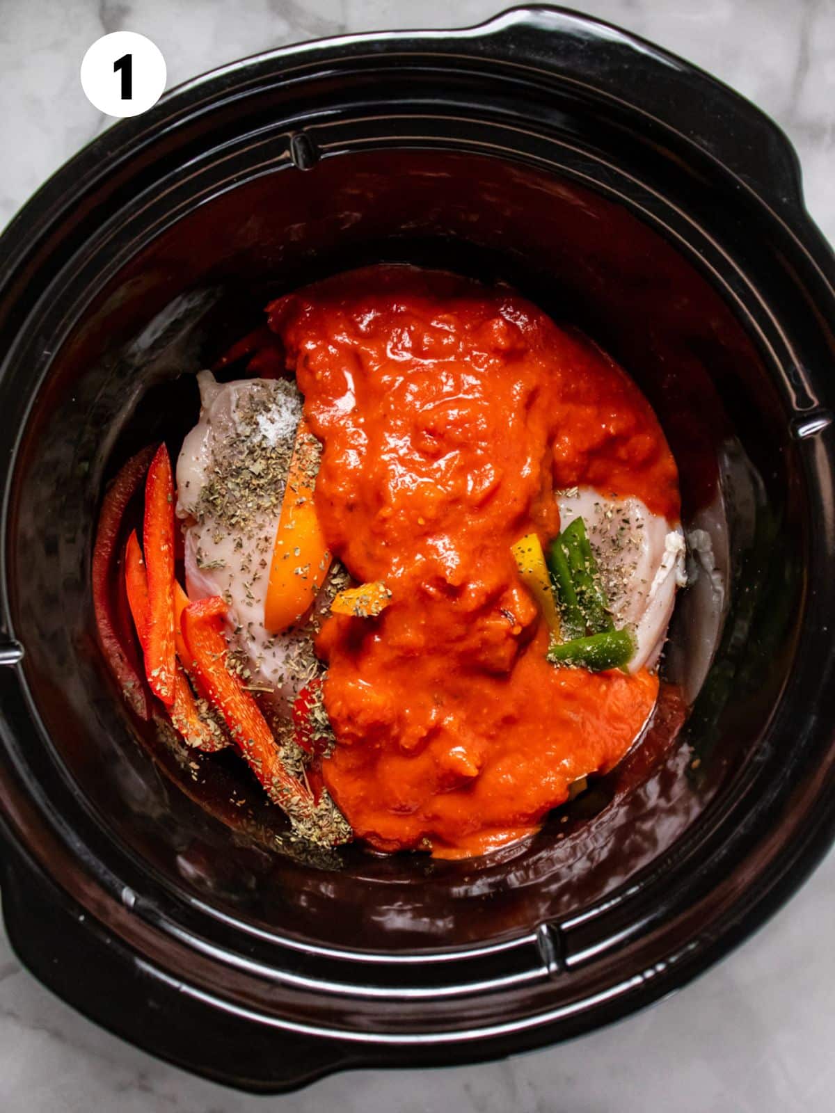 Ingredients for making crockpot chicken and peppers in the crockpot.