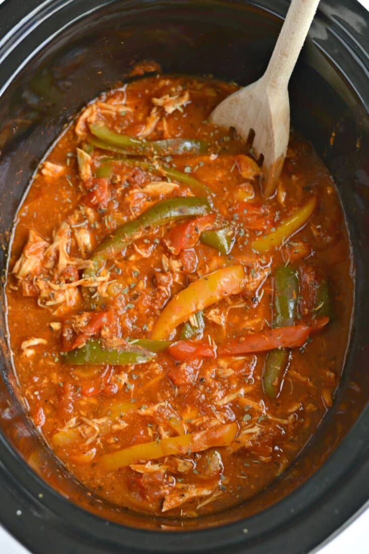 shredded chicken with peppers and marinara in a slow cooker