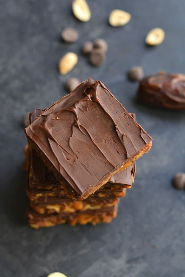 3 Ingredient Peanut Butter Chocolate Chip Bars!  They taste like candy, but are secretly good for you! Sweetened with dates, these simple no bake bars easy to make and kid friendly. Vegan, Gluten Free + Paleo Option
