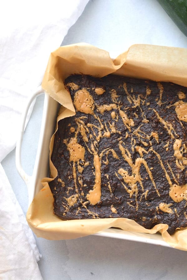 Creamy Zucchini Chocolate Espresso Brownies with an almond butter swirl! Made with almond butter, chocolate, espresso and oats, these brownies are gluten free, vegan and low calorie with a Paleo option too. Luscious chocolate-y brownies that make healthy eating easy! Gluten Free + Low Calorie + Vegan