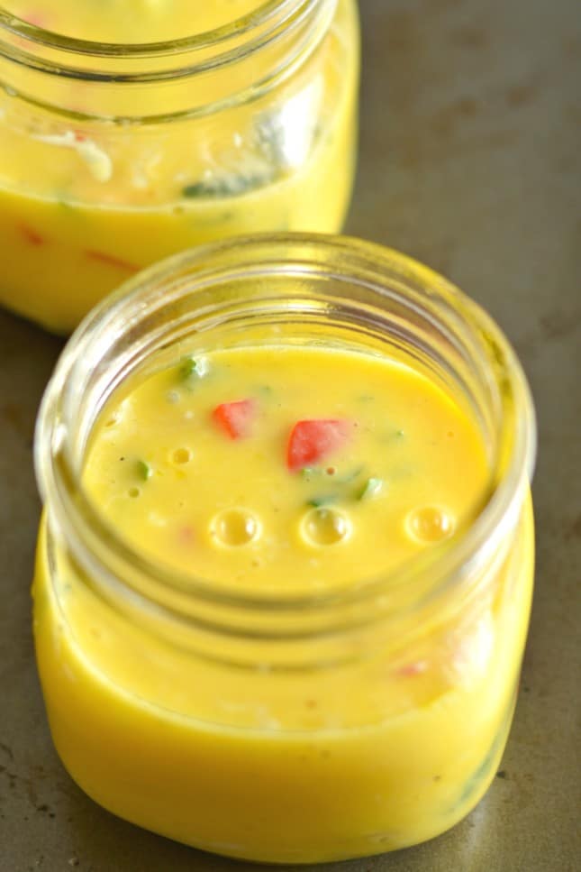 Mason Jar Eggs are the perfect on-the-go protein packed breakfast! These make ahead eggs are super easy, store fresh in the fridge for days and are completely customizable to your taste buds! 