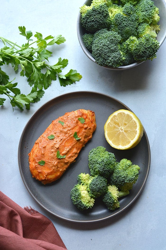 Greek Yogurt Paprika Chicken marinaded with yogurt, lemon and paprika! This gluten free, low calorie chicken recipe has a spicy kick and is high protein! Gluten Free + Low Calorie