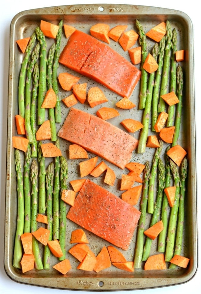 This One Pan Baked Salmon Asparagus & Sweet Potato is perfectly baked on a single pan for an EASY and filling dinner. A Paleo, Gluten Free & Low Calorie meal that takes just 30 minutes, ideal for any night!