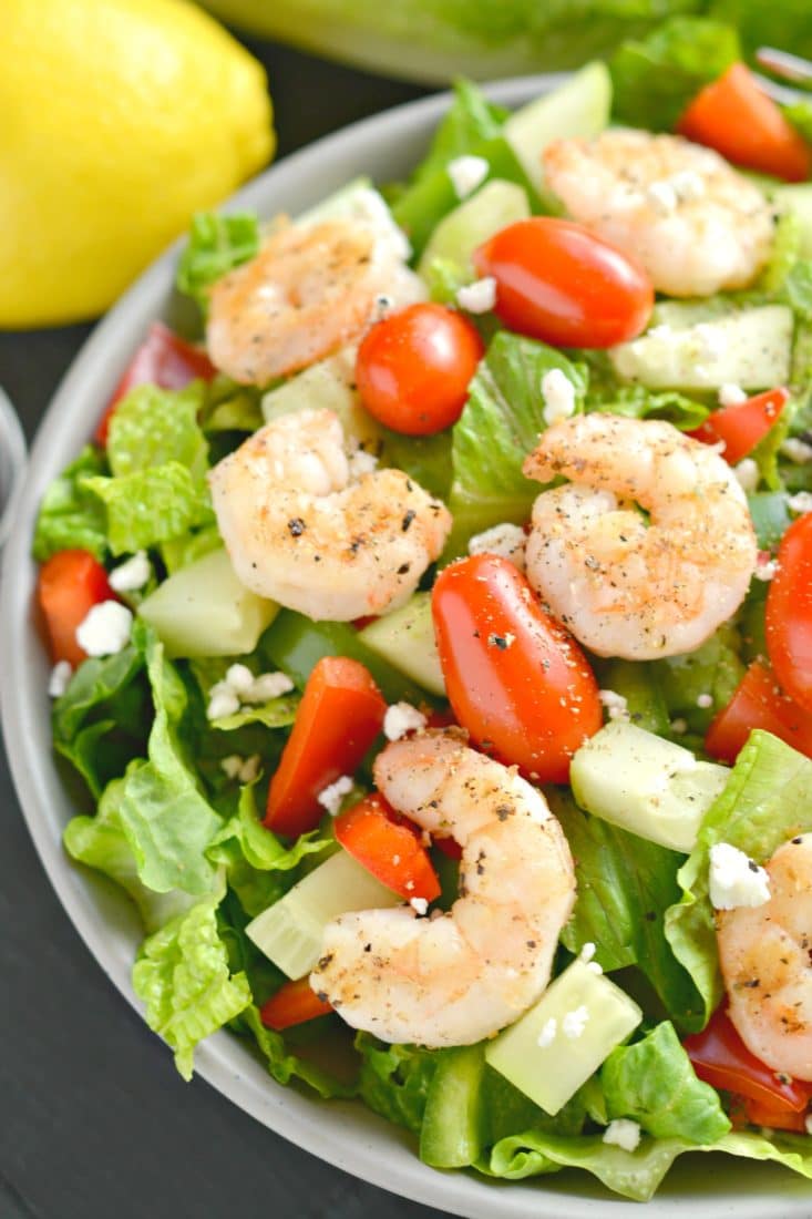 This Greek Shrimp Salad is a light, refreshing and EASY meal. Loaded with a secret blend of spices, freshly chopped vegetables and grilled shrimp, this healthy meal is equally delicious and filling!