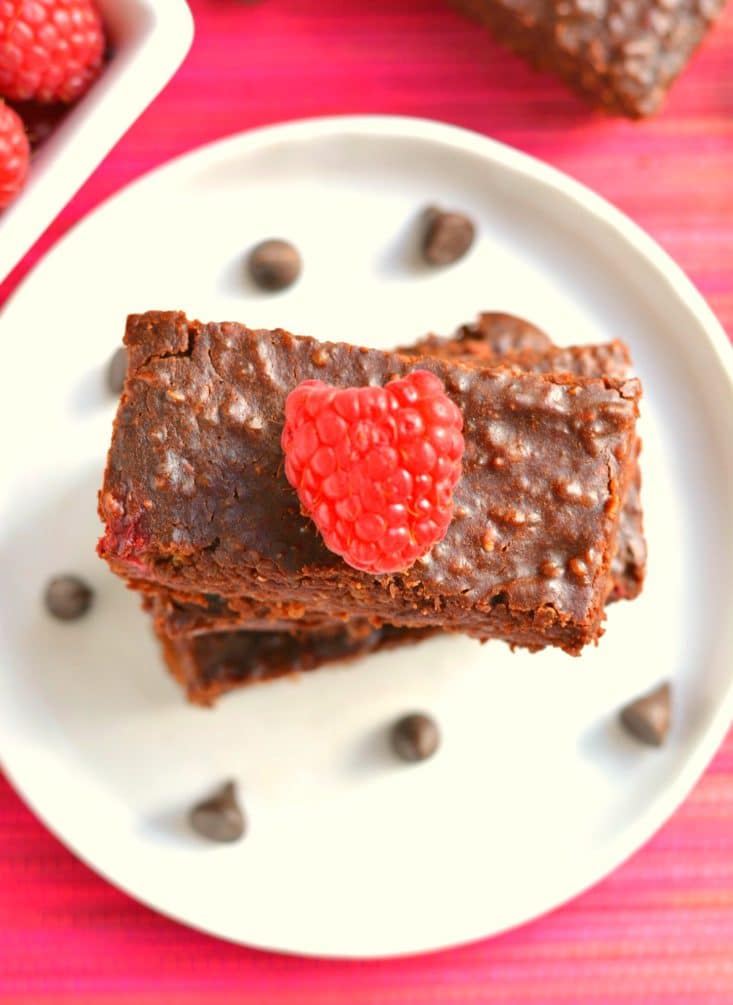 Vegan Chocolate Raspberry Quinoa Brownies made flourless with almond butter, quinoa, cocoa powder and fresh raspberries. These thick, chewy & creamy brownies are guaranteed to be the best brownie of your life!
