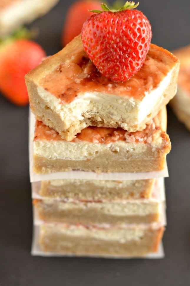 Greek Strawberry Cheesecake Bars are a light version of classic cheesecake. Made gluten free with Greek cream cheese & than the original for a healthier dessert! 