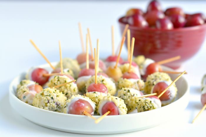 Transform frozen grapes into Greek Yogurt Grape Popsicles dipped in hemp seeds! A sweet & healthy snack, perfect for hot days and always a party favorite!