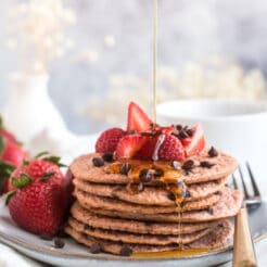 Healthy Strawberry Oat Chocolate Chip Pancakes made low calorie with gluten free oats and Greek yogurt. A healthy strawberry pancake recipe!