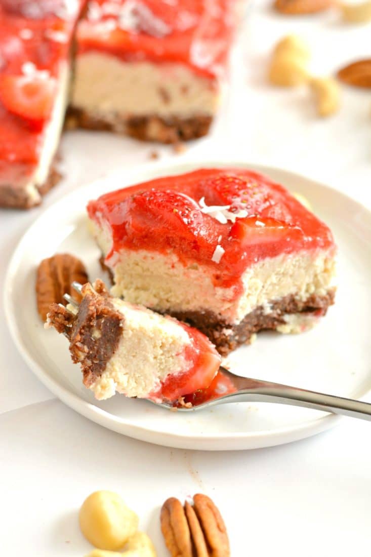 Raw Strawberry Cake is a nutrition powerhouse! Made with a cocoa macadamia pecan crust, creamy cashew filling and topped with a strawberry sauce, this is a dessert you cannot resist. Vegan, Paleo, gluten free, grain free & dairy free!