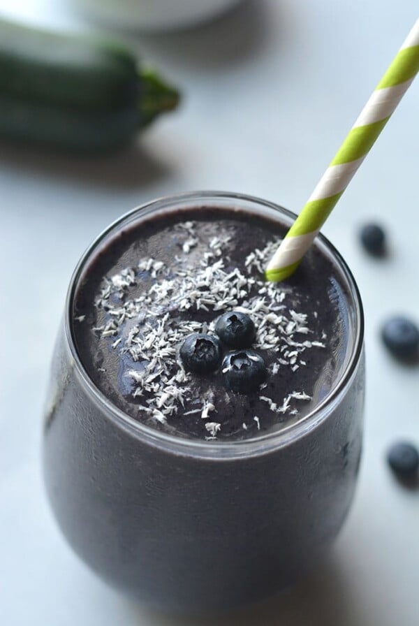 Blueberry Protein Smoothie made with zucchini! High protein, high in Vitamin C and antioxidants. An on the go smoothie, perfect for breakfast and a great way to sneak in vegetables! Gluten Free + Vegan + Paleo option