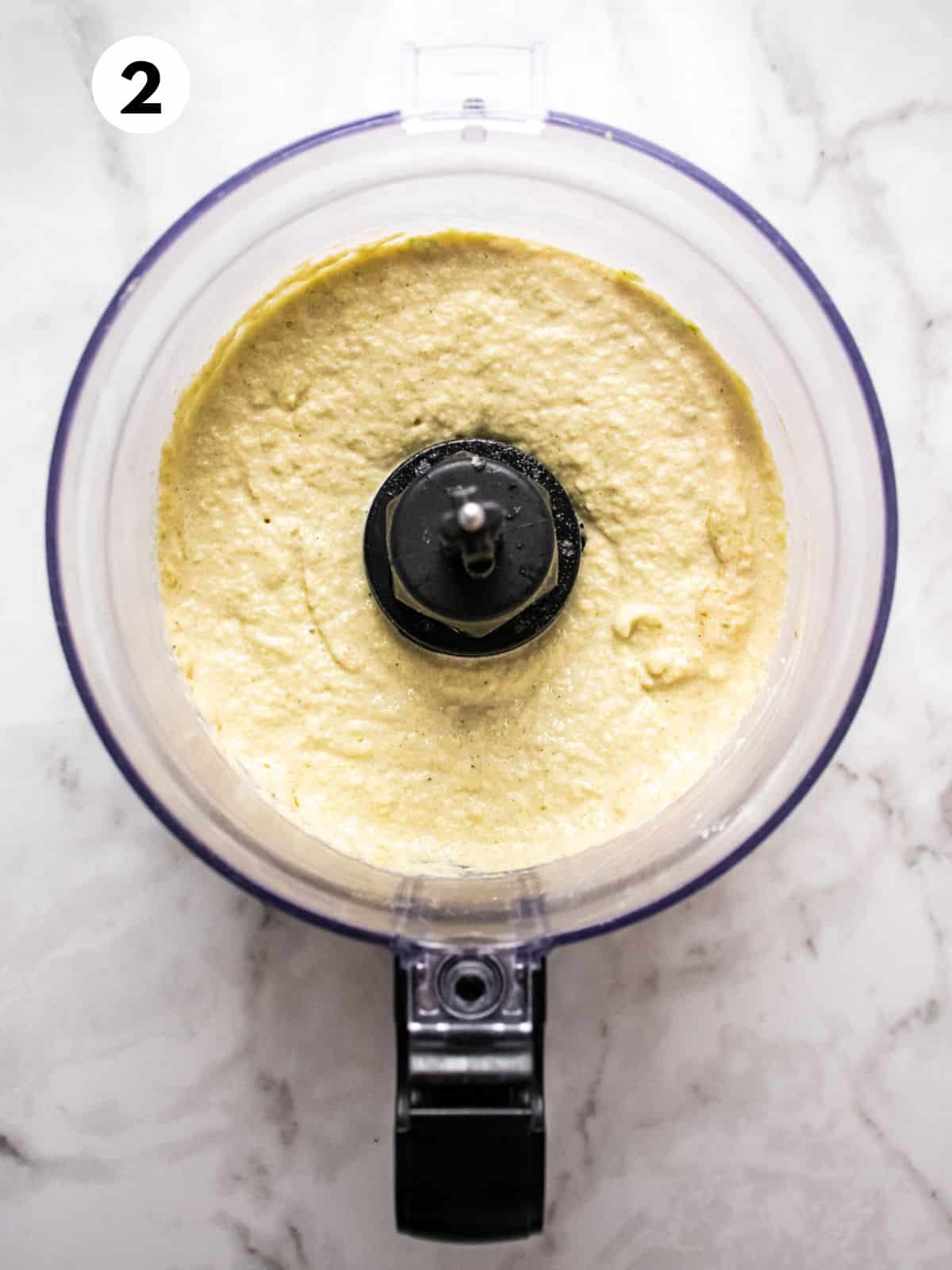 Zucchini hummus blended in a food processor.