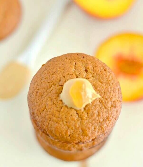 Peach Cashew Muffins made extra creamy with cashew butter. A mildly sweet, healthy muffin that makes a nutritious on the go snack! Gluten free and low calorie!