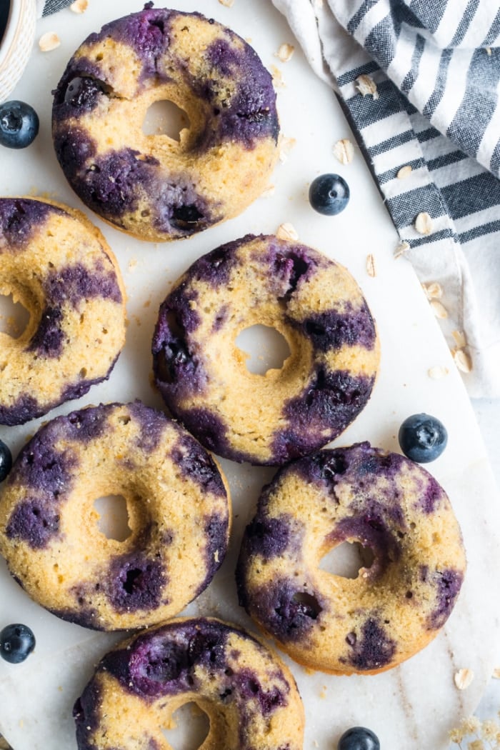 Blueberry Chickpea Donuts are backed for a healthier donut that is low calorie, low in sugar, naturally gluten free and delicious! No one will ever guess these donuts are made with chickpeas!