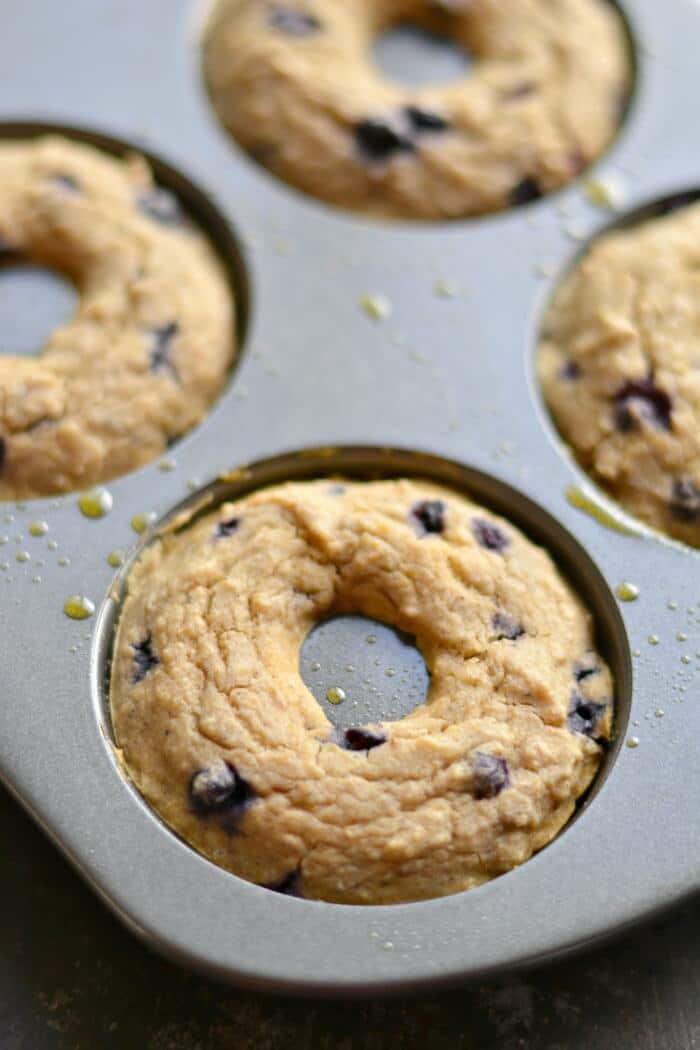 Baked Blueberry Chickpea Donuts are low in sugar & big on flavor! The creamiest donuts you'll ever make, and no one will ever guess their made with chickpeas! A yummy high protein, complex carb breakfast or treat. Gluten free + Low Calorie + Vegan option.