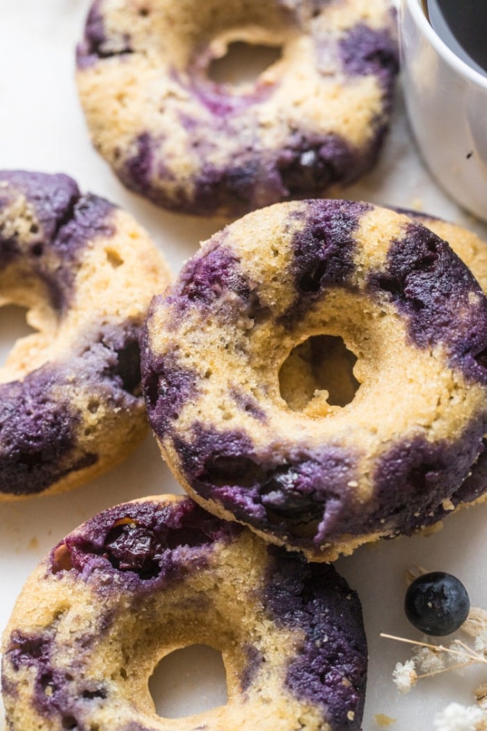 Blueberry Chickpea Donuts are backed for a healthier donut that is low calorie, low in sugar, naturally gluten free and delicious! No one will ever guess these donuts are made with chickpeas!