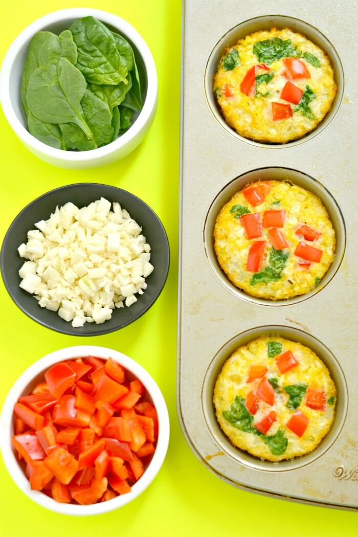 Cauliflower Egg Muffins made with cauliflower rice! With 6 grams of protein & less than 1 gram of carbs, these egg muffins make a nutritious make ahead breakfast you can take with you on-the-go! Paleo + Gluten Free + Low Calorie.