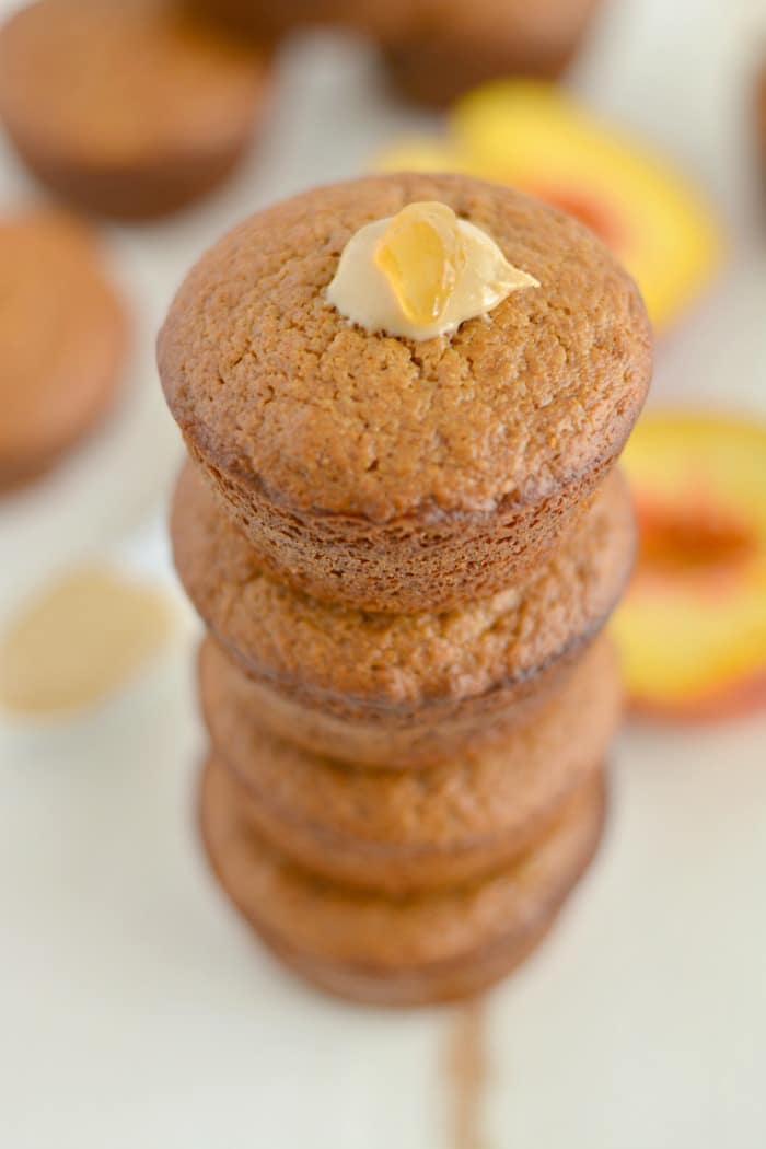 Peach Cashew Muffins made extra creamy with cashew butter. A mildly sweet, healthy muffin that makes a nutritious on the go snack! Gluten free and low calorie!