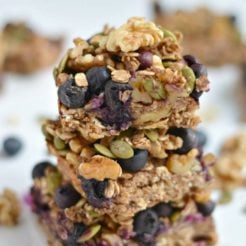 Take your granola bars up a notch with a chewy, oven-baked these Blueberry Protein Walnut Breakfast Bars packed nutrients & antioxidants! Made with a protein-walnut-oat base and topped with a blueberry, walnut & oat crumble this breakfast has everything & more! Gluten Free + Vegan + Low Calorie