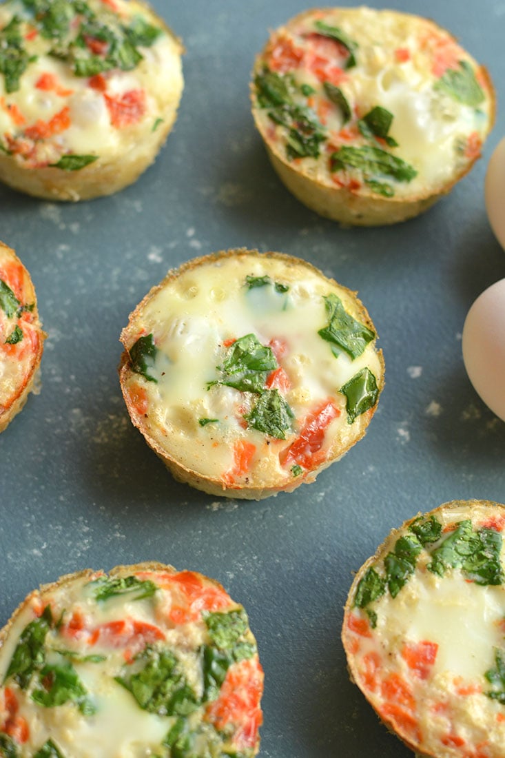 Cauliflower Egg Muffins made with cauliflower rice! With 6 grams of protein & less than 1 gram of carbs, these egg muffins make a nutritious make ahead breakfast you can take with you on-the-go! Paleo + Gluten Free + Low Calorie.