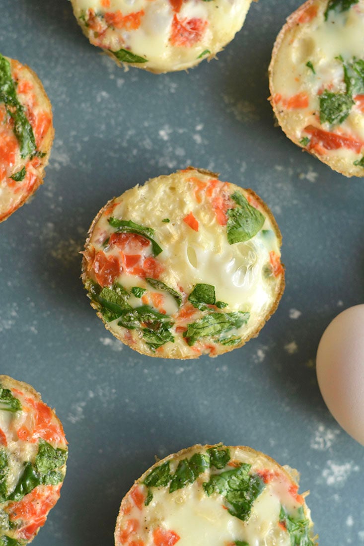 Cauliflower Egg Muffins made with cauliflower rice! With 6 grams of protein & less than 1 gram of carbs, these egg muffins make a nutritious make ahead breakfast you can take with you on-the-go! Paleo + Gluten Free + Low Calorie.