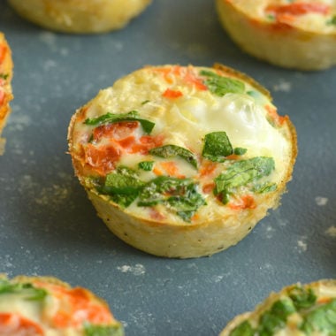 Cauliflower Egg Muffins made with cauliflower rice! With 6 grams of protein & less than 1 gram of carbs, these egg muffins make a nutritious make ahead breakfast you can take with you on-the-go! Paleo + Gluten Free + Low Calorie.