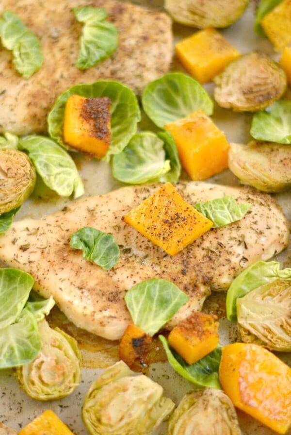 This One Pan Chicken Brussels Sprouts & Butternut Squash is perfectly baked on a single pan for an EASY and filling dinner. A Paleo, Gluten Free & Low Calorie meal that takes 30 minutes, ideal for any weeknight meals or meal prepping!