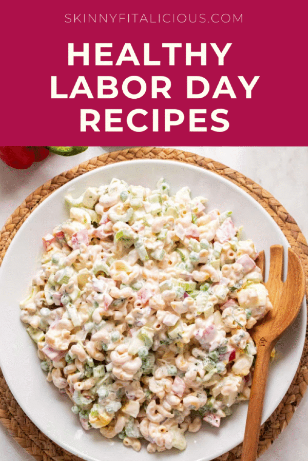 picture of macaroni salad on a white plate with a wooden spoon.