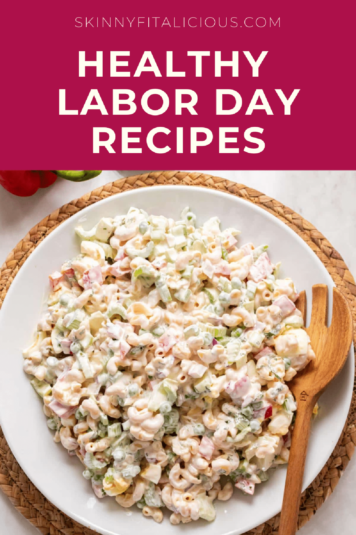 picture of macaroni salad on a white plate with a wooden spoon.