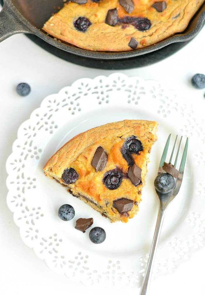 Pumpkin Blueberry Chocolate Skillet Cake! Savor the flavors of fall with swirls of pumpkin and rings of blueberries & chocolate in a thick coconut flour skillet cake that's healthy, EASY & addicting! The perfect Paleo + Gluten Free fall breakfast, dessert or snack. 