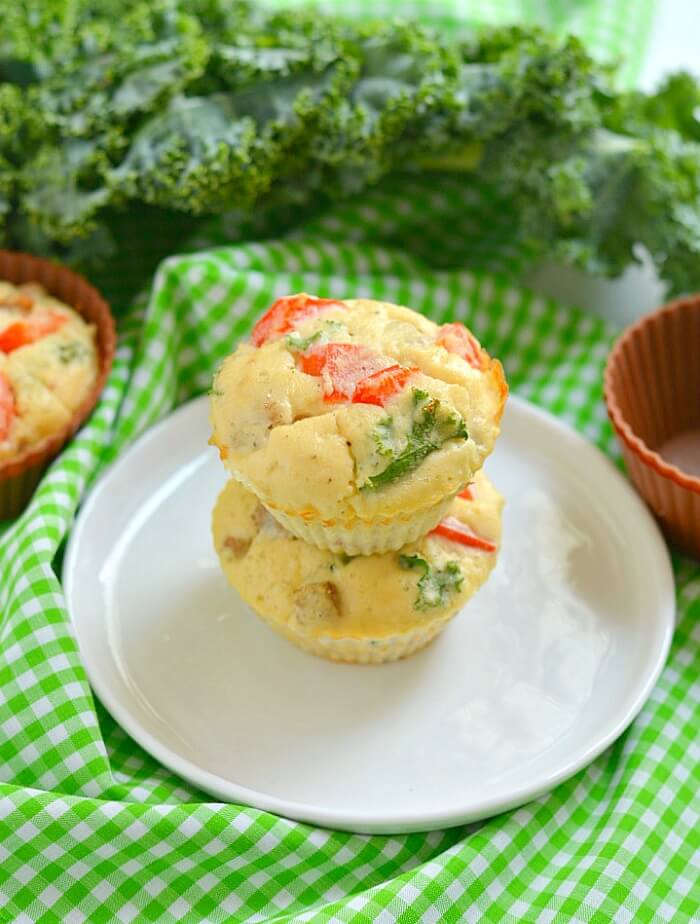 Paleo Sausage Kale Coconut Egg Muffins made with coconut flour for a rich, creamy texture. Hearty & filling breakfast muffins that tastes like mini pizzas! Gluten Free + Low Calorie + Paleo