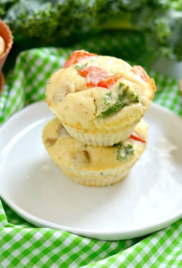 Paleo Sausage Kale Coconut Egg Muffins made with coconut flour for a rich, creamy texture. Hearty & filling breakfast muffins that tastes like mini pizzas! Gluten Free + Low Calorie + Paleo