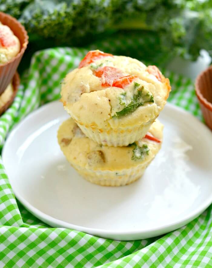 Paleo Sausage Kale Coconut Egg Muffins made with coconut flour for a rich, creamy texture. Hearty & filling breakfast muffins that tastes like mini pizzas! Gluten Free + Low Calorie + Paleo