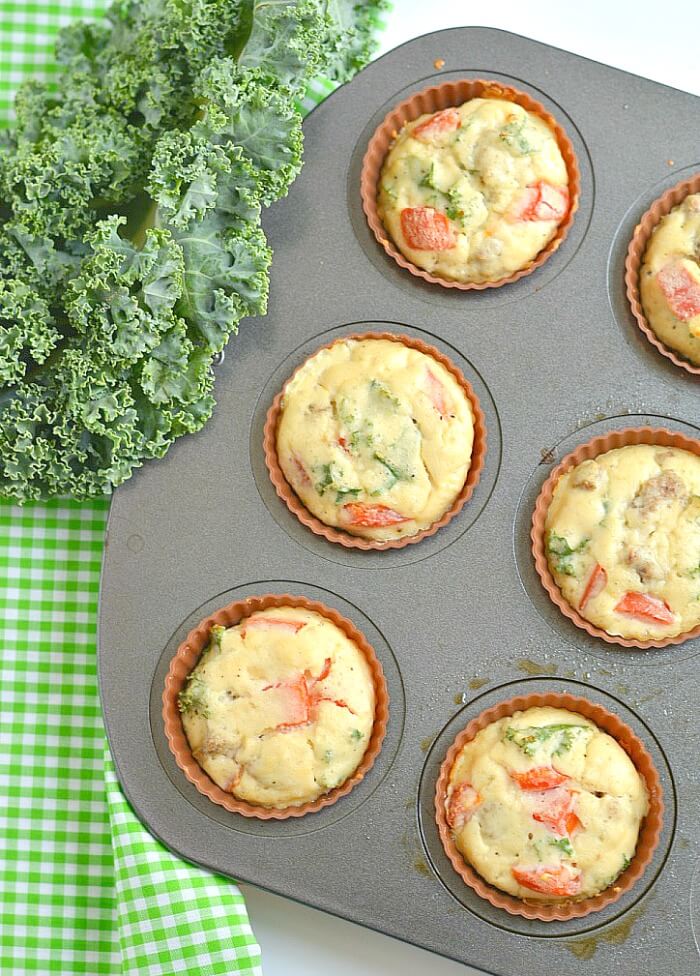 Paleo Sausage Kale Coconut Egg Muffins made with coconut flour for a rich, creamy texture. Hearty & filling breakfast muffins that tastes like mini pizzas! Gluten Free + Low Calorie + Paleo