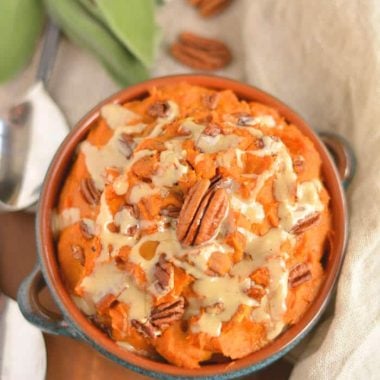 This warm Maple Tahini Butternut Sweet Potato Mash is a healthier version of sweet potato casserole. Lightly sweetened with maple syrup, savory tahini sauce and topped with pecans to make the perfect side dish for fall, winter and holiday gatherings. Gluten Free + Low Calorie + Vegan + Paleo
