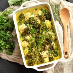 Turmeric Cauliflower Broccoli Gratin casserole made with a rich white wine sauce & sprinkled with parmesan cheese. A low carb side perfect for dinner or the holidays!