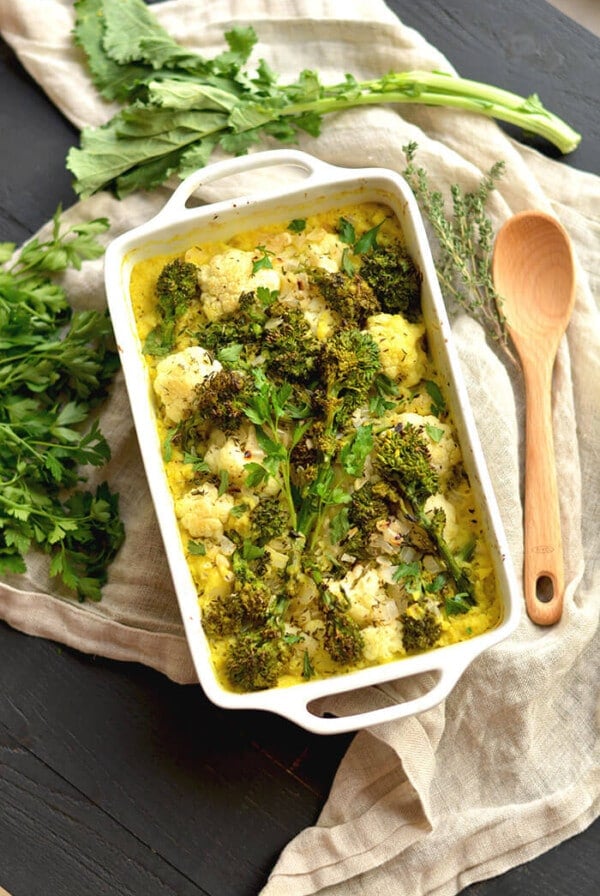 Turmeric Cauliflower Broccoli Gratin casserole made with a rich white wine sauce & sprinkled with parmesan cheese. A low carb side perfect for dinner or the holidays!