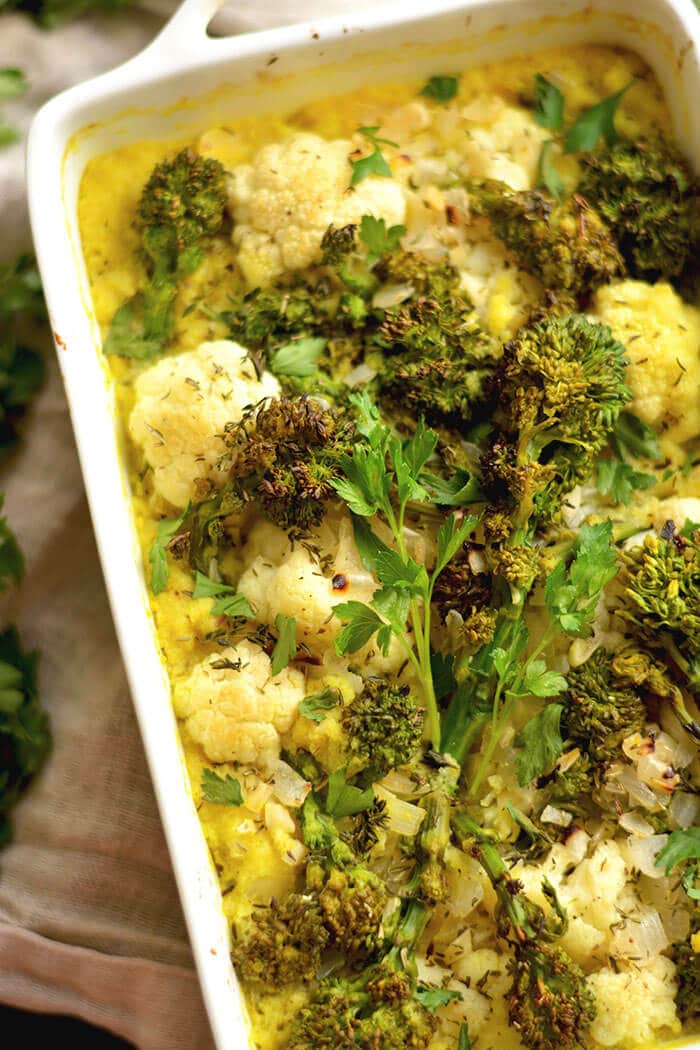 Turmeric Cauliflower Broccoli Gratin casserole made with a rich white wine sauce & sprinkled with parmesan cheese. A low carb side perfect for dinner or the holidays! 