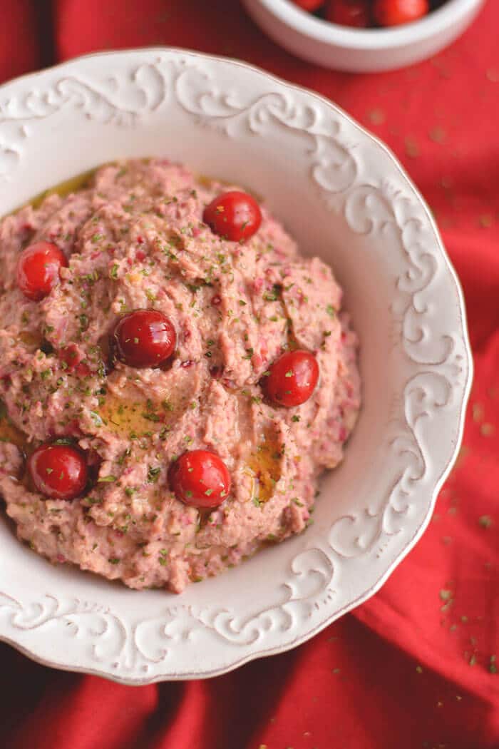 Spice things up with a Cranberry Hummus! This twist on traditional hummus makes a tasty holiday appetizer or winter snack, & guaranteed to add a kick to your plate! Gluten Free + Low Calorie + Vegan