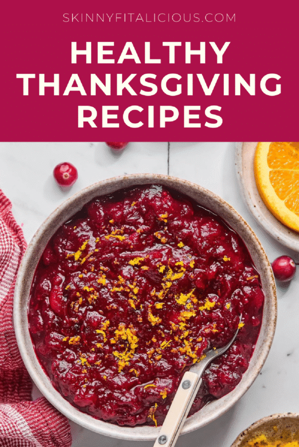 cranberry sauce in a brown bowl with a spoon in it.