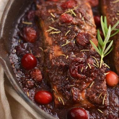 Skillet Cranberry Balsamic Salmon! This ONE skillet roasted balsamic salmon infused with maple syrup & cranberries is a simple 30 minute sweet & pungent dinner. Perfect for holiday & winter dinner menus! Paleo + Gluten Free + Low Calorie!