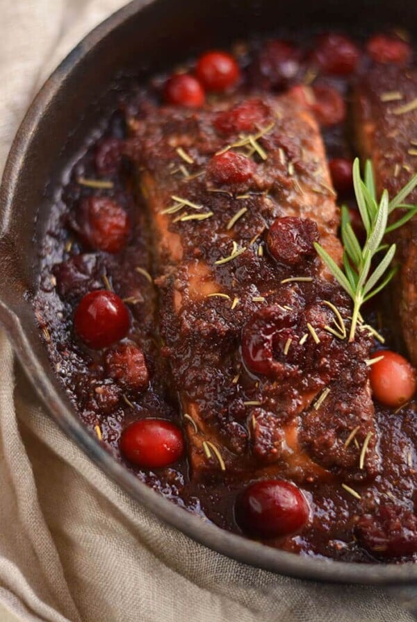 Skillet Cranberry Balsamic Salmon! This ONE skillet roasted balsamic salmon infused with maple syrup & cranberries is a simple 30 minute sweet & pungent dinner. Perfect for holiday & winter dinner menus! Paleo + Gluten Free + Low Calorie!