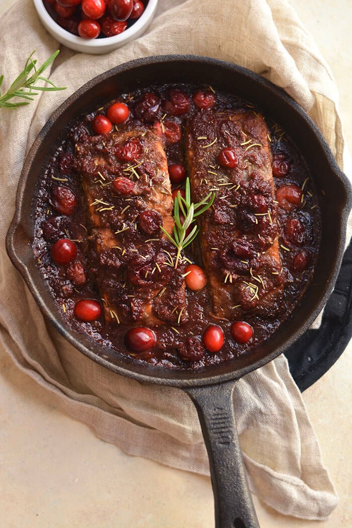 Skillet Cranberry Balsamic Salmon! This ONE skillet roasted balsamic salmon infused with maple syrup & cranberries is a simple 30 minute sweet & pungent dinner. Perfect for holiday & winter dinner menus! Paleo + Gluten Free + Low Calorie! 