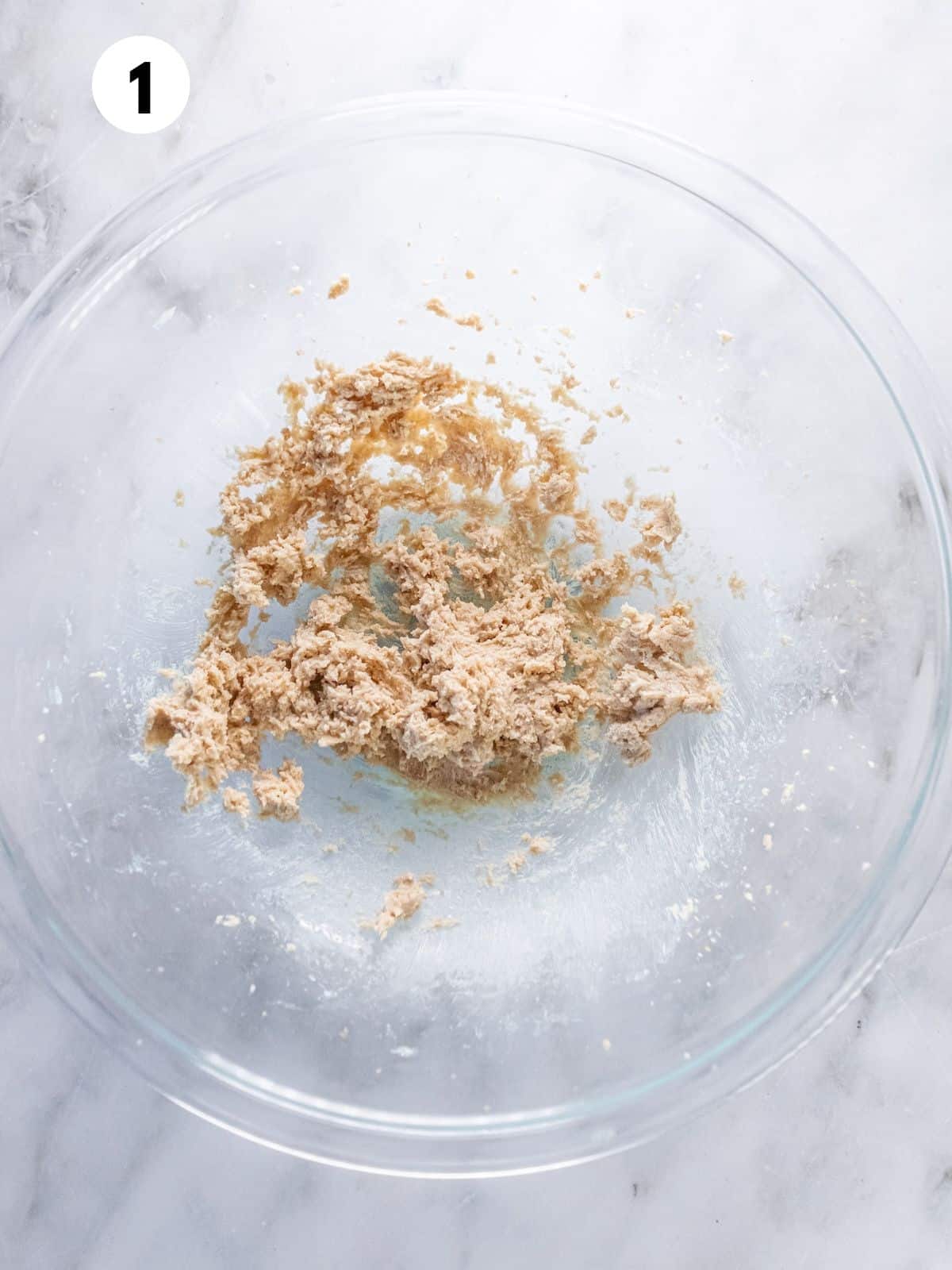 Butter and sugar creamed in a bowl. 