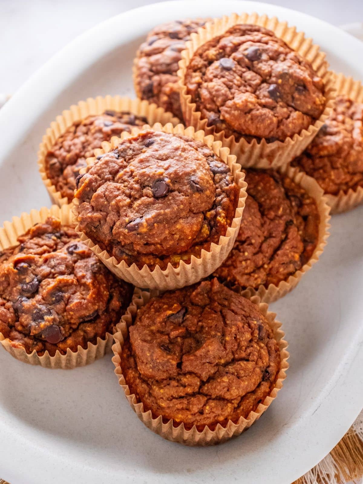 Pumpkin oatmeal muffins on a plate.