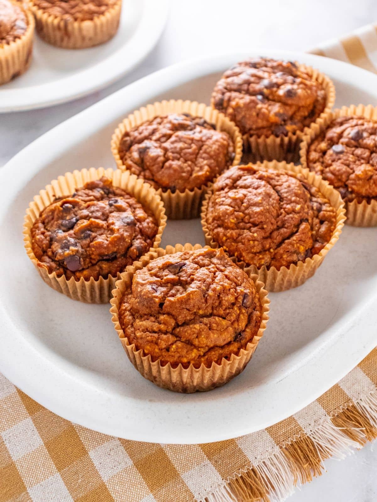 Pumpkin oatmeal muffins on a plate.